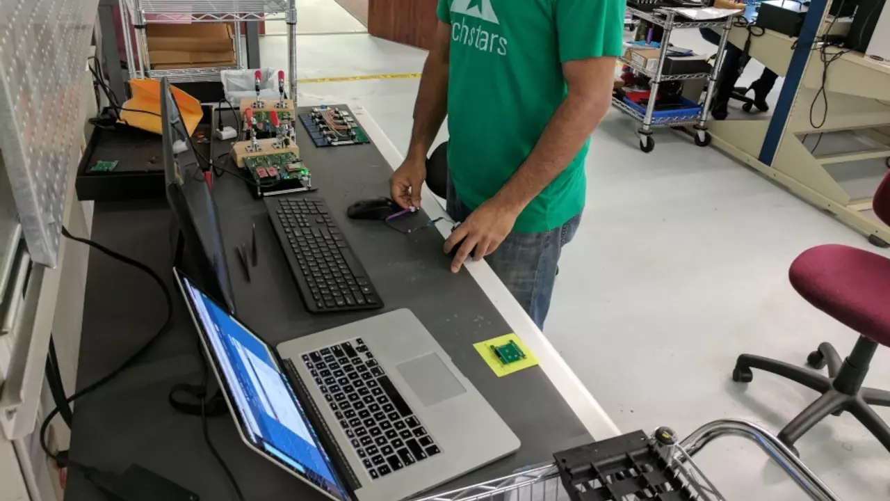 Figure 3: Aditya Bansal setting up the testing area for preliminary testing of Kinetic’s production run.