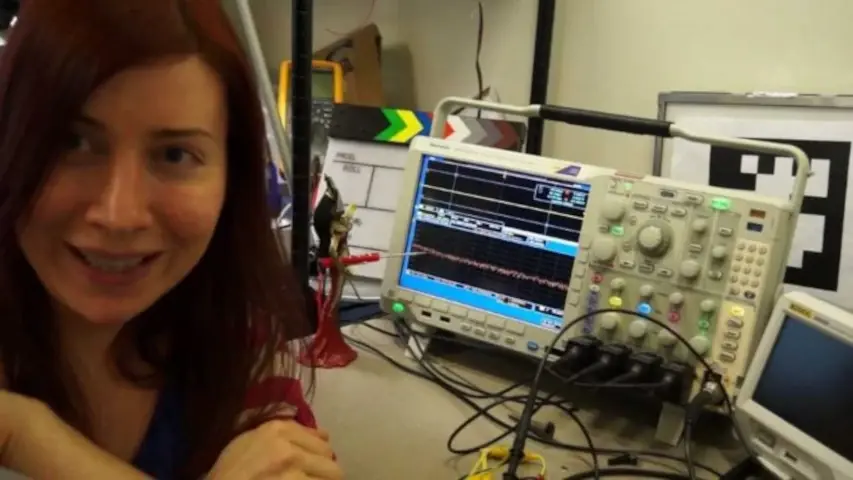 Jeri debugging some hardware with her oscilloscope.